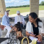 Mother and child at community event bench