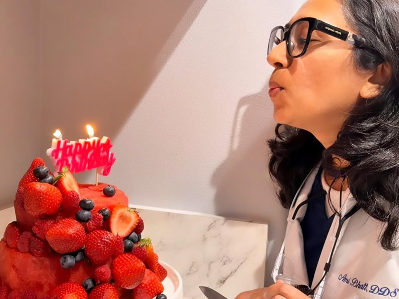 Blowing candle of cake