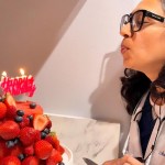 Blowing candle of cake